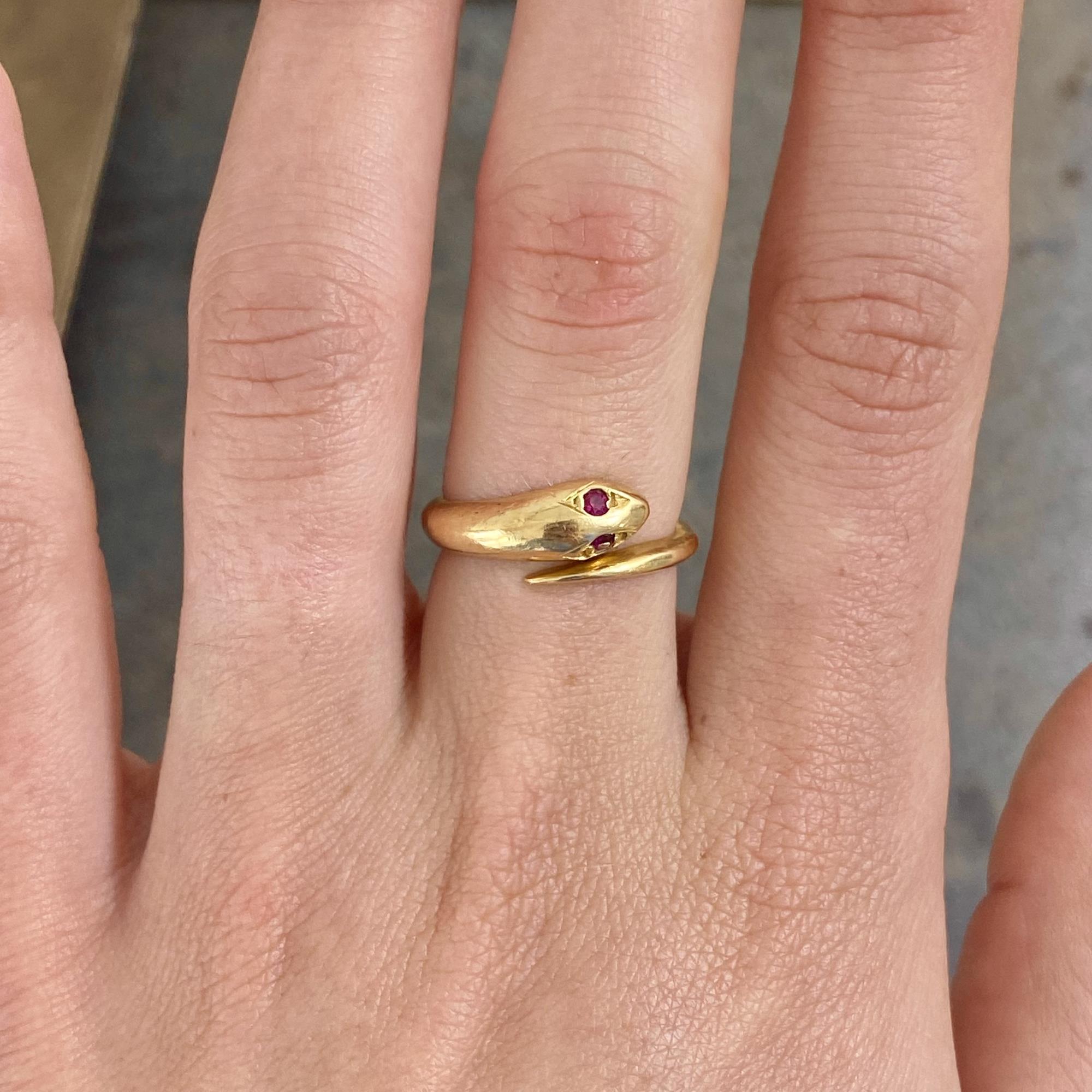 Vintage 18kt gold ring featuring a snake design with synthetic rubies
