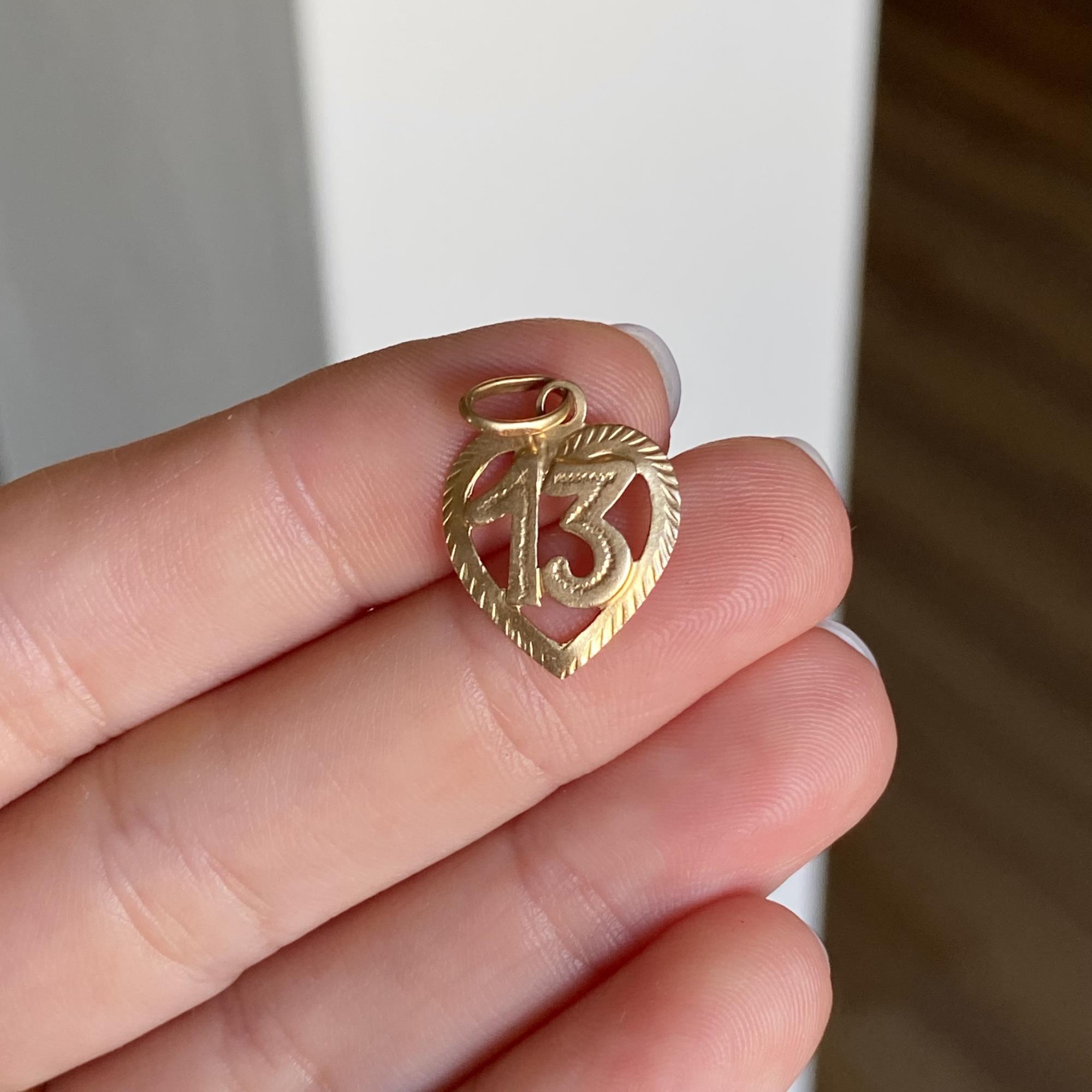 Ciondolo vintage in oro 18kt cuore con 13 portafortuna